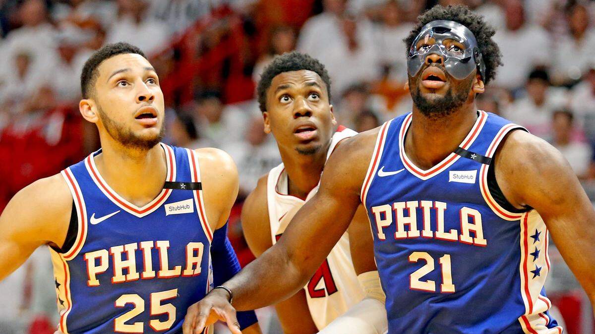 Miami Heat Hassan Whiteside (21) is flanked by Philadelphia 76ers Ben Simmons (25) and Joel Embiid (21) in the first quarter in a playoff Game 4 of their playoff series on April 21.
