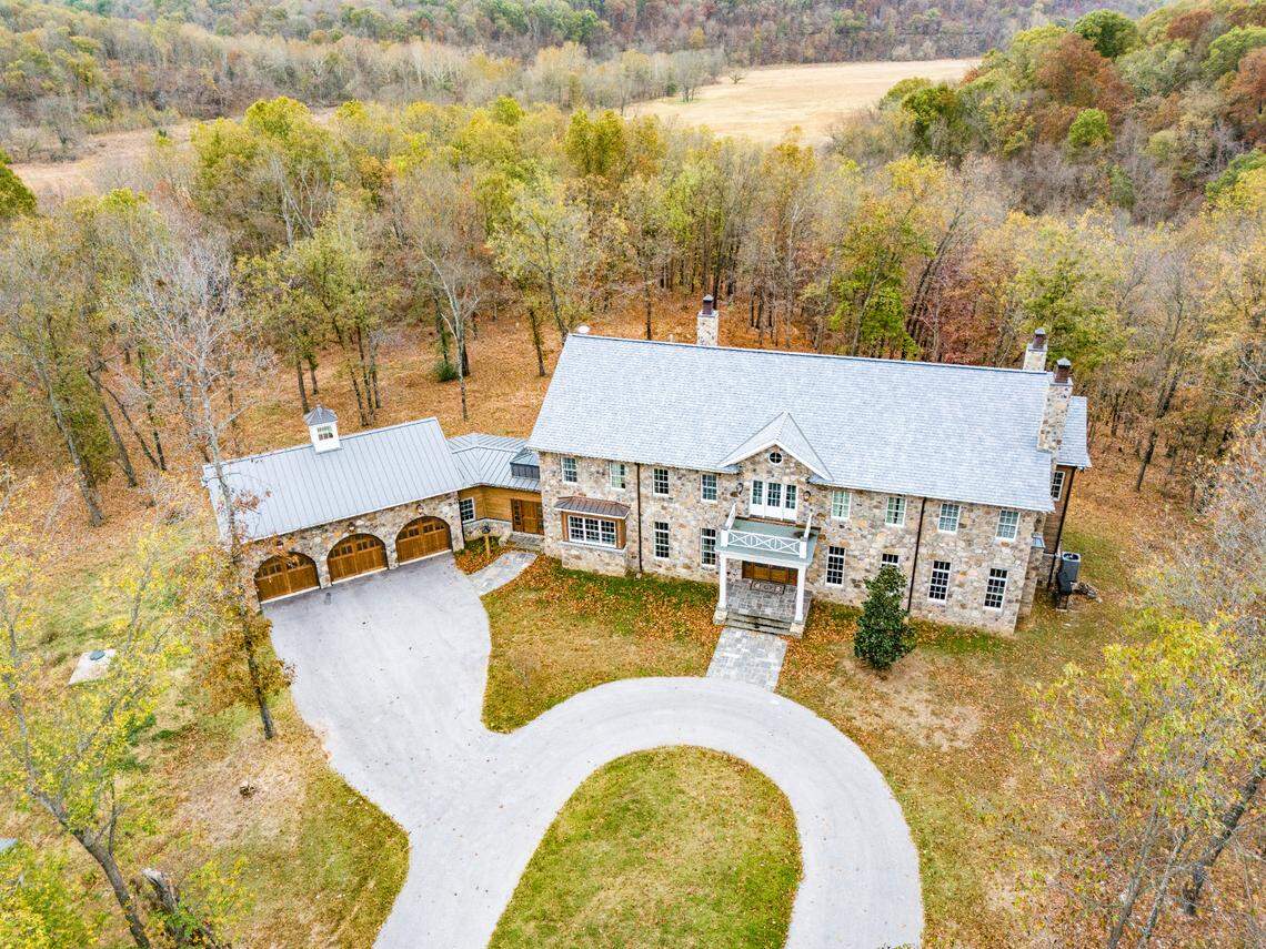 The Arkansas home sits on 58 secluded, wooded acres.