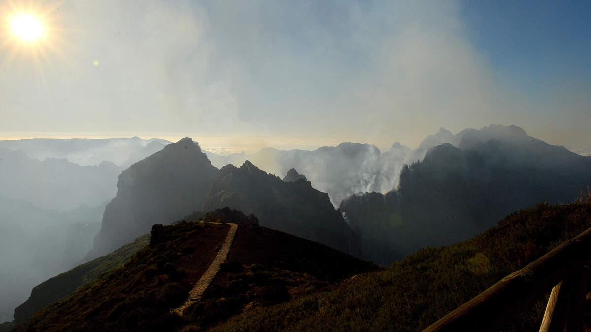 Smoke rises from a wildfire raging through Pico do Arieiro mountain on August 22, 2024 in Santana on the Portuguese island of Madeira, which broke out over a week ago in the Ribeira Brava district.