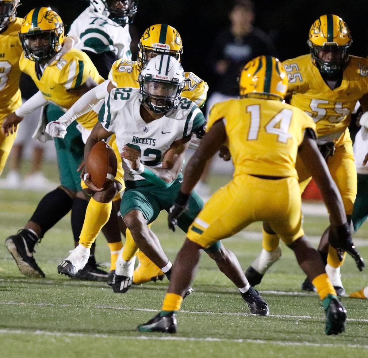 Miami Central Rockets running back Jonathan Harris (22) carries the ball against Killian Cougars during the FHSAA Region 4-5A high school football championship on Saturday, November 27, 2021 at Tropical Park in Miami. Andrew Uloza / for THE MIAMI HERALD