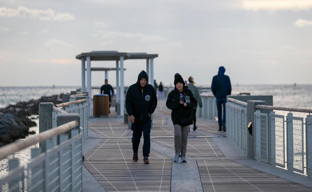 People visit South Pointe Park in Miami Beach as temperatures dip into the low 50s across South Florida on Saturday, January 29, 2022.