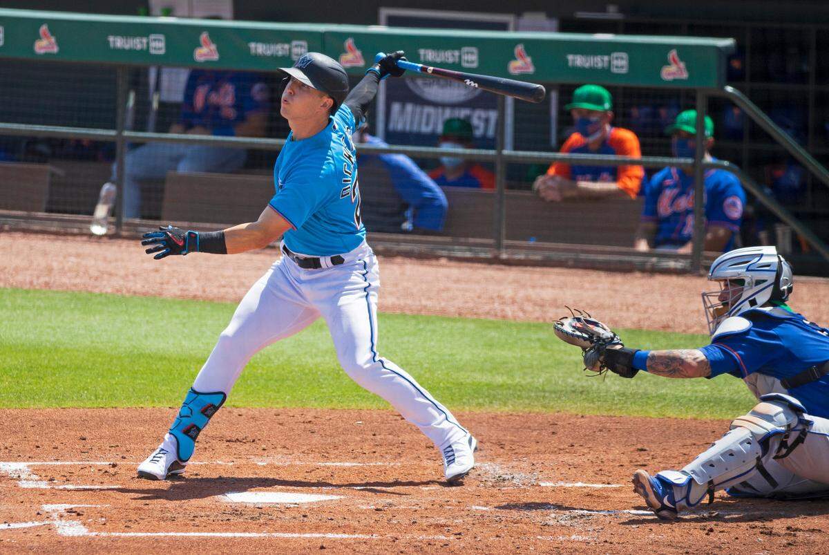Miami Marlins left fielder Corey Dickerson (23) batting during the third inning of their spring training baseball game against the New York Mets at Roger Dean Chevrolet Stadium on Wednesday, March 17, 2021 in Jupiter, Florida.