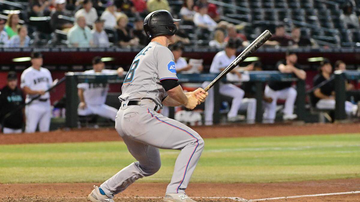 Miami Marlins shortstop Joey Wendle (18) hits an RBI double in the ninth inning against the Arizona Diamondbacks at Chase Field on Wednesday, May 10, 2023.