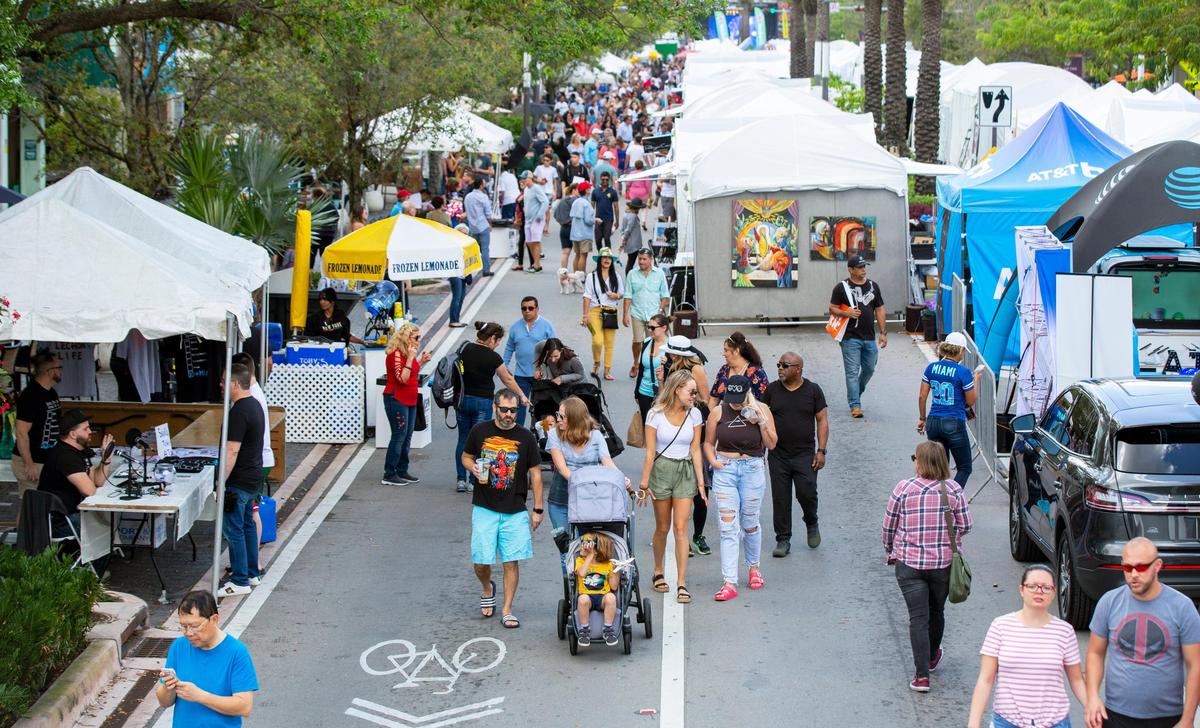 Crowds walk the street during Carnaval on the Mile at Miracle Mile in Coral Gables on March 7, 2020. Despite new coronavirus cases being reported in South Florida, attendees were generally unfazed and continued on with their weekend plans.