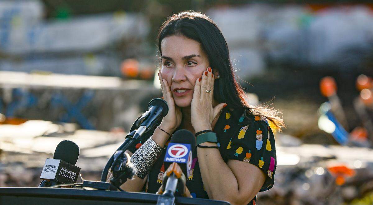 Raquel Oliveir, speaks at a Moment of Reflection ceremony marking the transition into the next phase of the Champlain Towers South Memorial project at Veterans Park, in Surfside, Florida on Wednesday, February 4, 2026. Oliveira lost her son Lorenzo Olveira Leone, 5, and husband Alfredo Leone during the collapse.