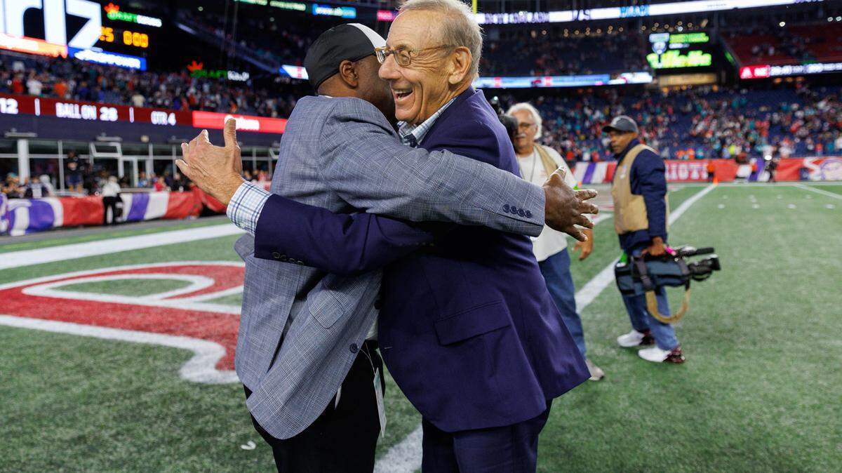Miami Dolphins general manager Chris Grier hugs Dolphins owner Stephen Ross after the Dolphins 24-17 win over the Patriots during an NFL football game at Gillette Stadium on Sunday, Sept. 17, 2023 in Foxborough, MA.