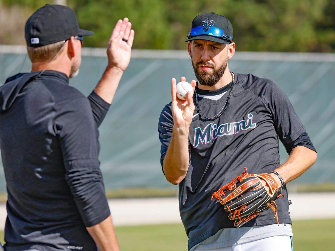 Miami Marlins pitcher Matt Barnes talks with a coach at Roger Dean Chevrolet Stadium in Jupiter, Florida on Thursday, February 16, 2023.