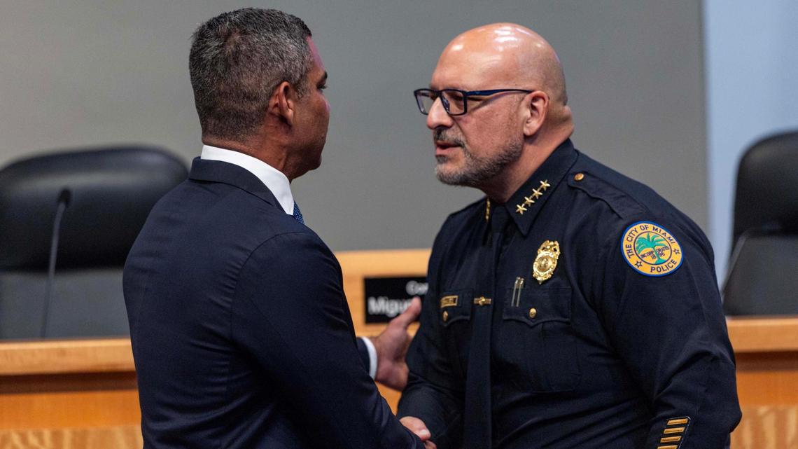 Miami Mayor Francis Suarez, left, shakes hands with Police Chief Manuel A. Morales, right, during a press conference discussing mid-year crime stats on Thursday, July 17, 2025, in Miami.