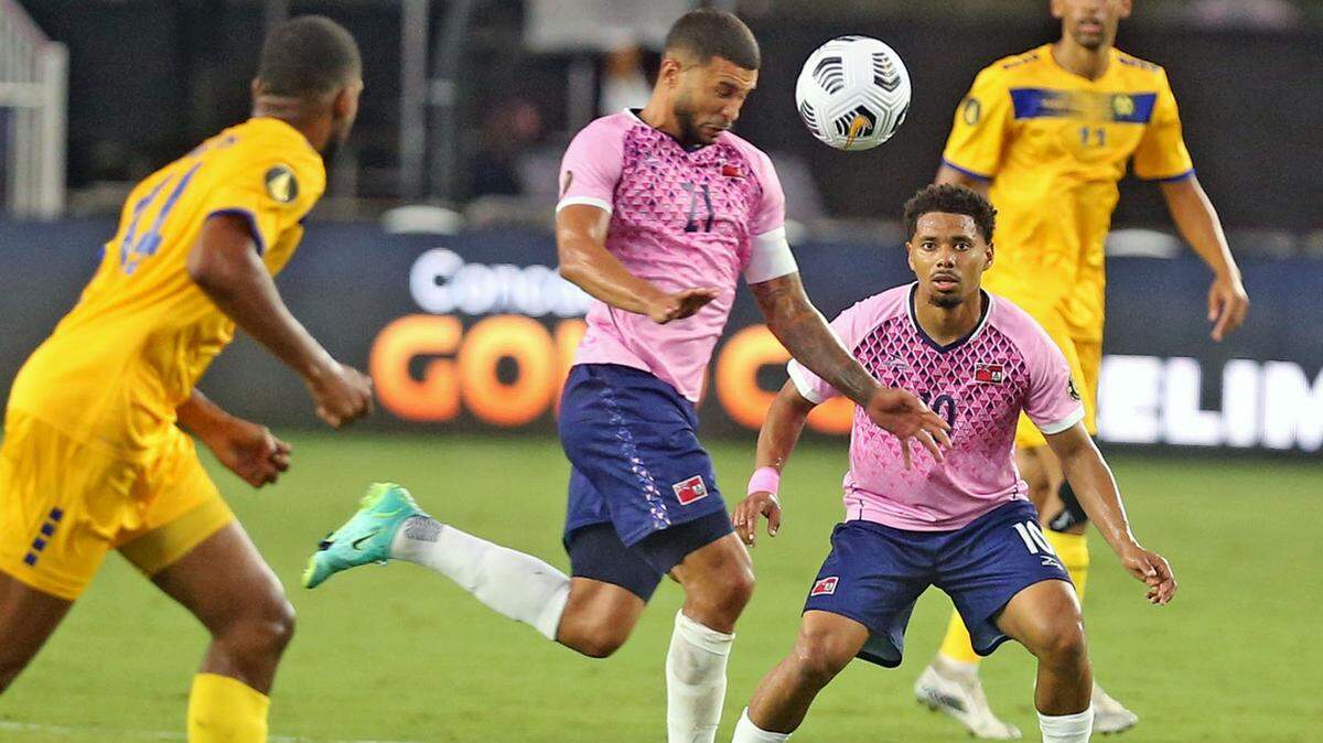 Bermuda’s Nahki Wells (21) heads the ball as they play Barbados in the 2021 Gold Cup preliminary round matches at DRV PNK Stadium in Fort Lauderdale, July 2, 2021. Wells scored a hat trick in the 8-1 win, including a goal in the 17th second -- fastest in Gold Cup history.