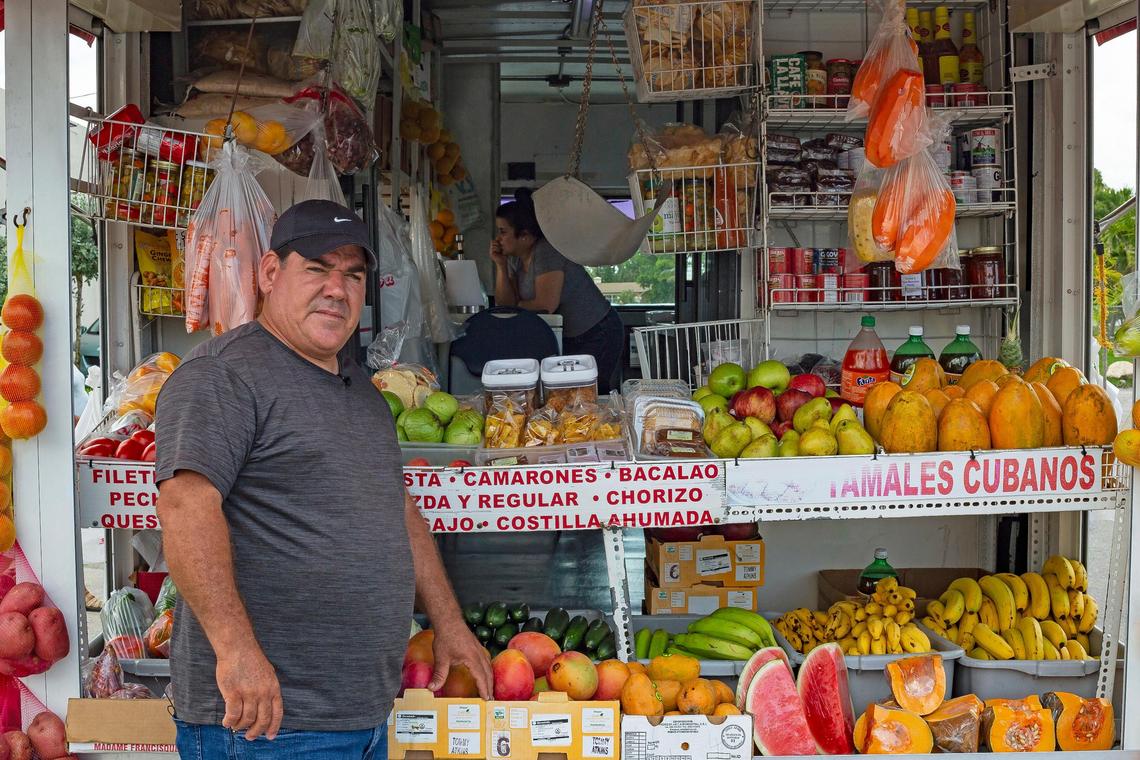 Arturo Tamayo stands behind his bodega truck waiting for customers to stroll by, while his wife Nancy tends the smoothie blender inside, in Miami, FL, on Wednesday, June 20, 2018.