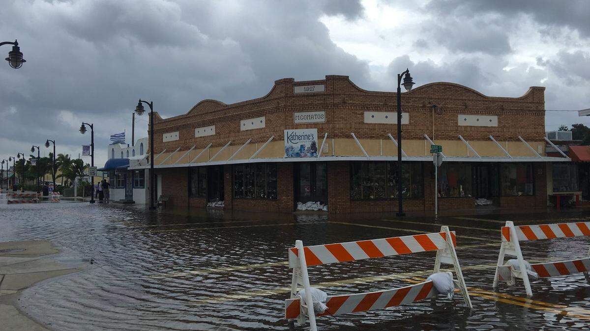 High tide from offshore hurricane Michael creeps up into the Sponge Docks in Tarpon Springs Wednesday afternoon 10/10/2018 after the Anclote River backs up. In 2019, Tarpon Springs recently formed a citizen sustainability advisory committee to help the city plan for the effects of sea level rise and climate change.