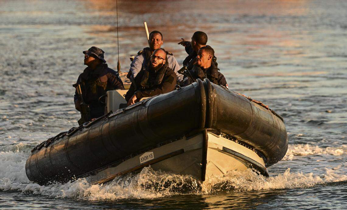 A Trinidad and Tobago Coast Guard patrol vessel secures the waterways surrounding the USS Gravely, which was docked at Port of Spain, Trinidad’s  capital,  on Oct. 27, 2025. 