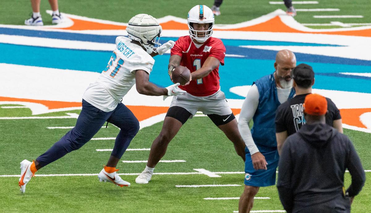 Miami Dolphins quarterback Tua Tagovailoa (1) and running back Raheem Mostert (31) run drills during team practice at the Baptist Health Training Complex on Wednesday, Sept. 6, 2023 in Miami Gardens, Fla.