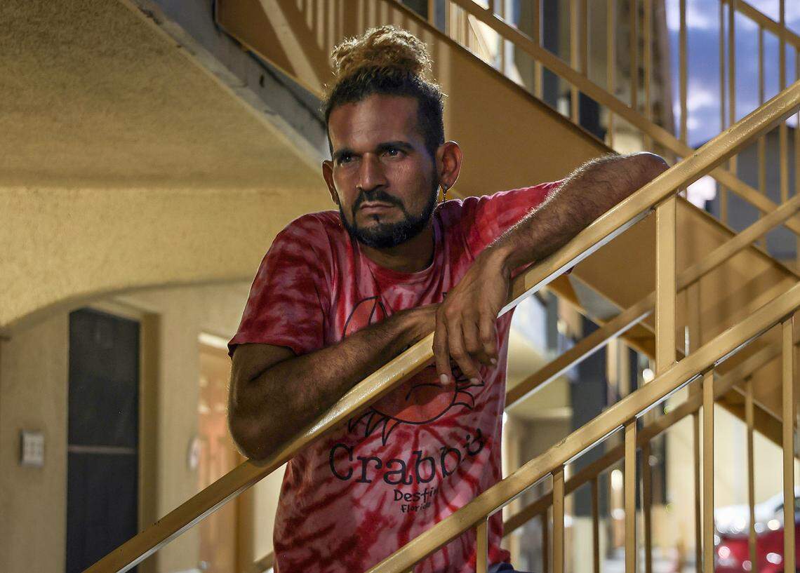 Venezuelan migrant Luis Oswaldo, 39, stands at a La Quinta where he was left stranded after being recruited by Vertol Systems Company. He wears a donated T-shirt from Destin, Florida, the location of the company’s headquarters.