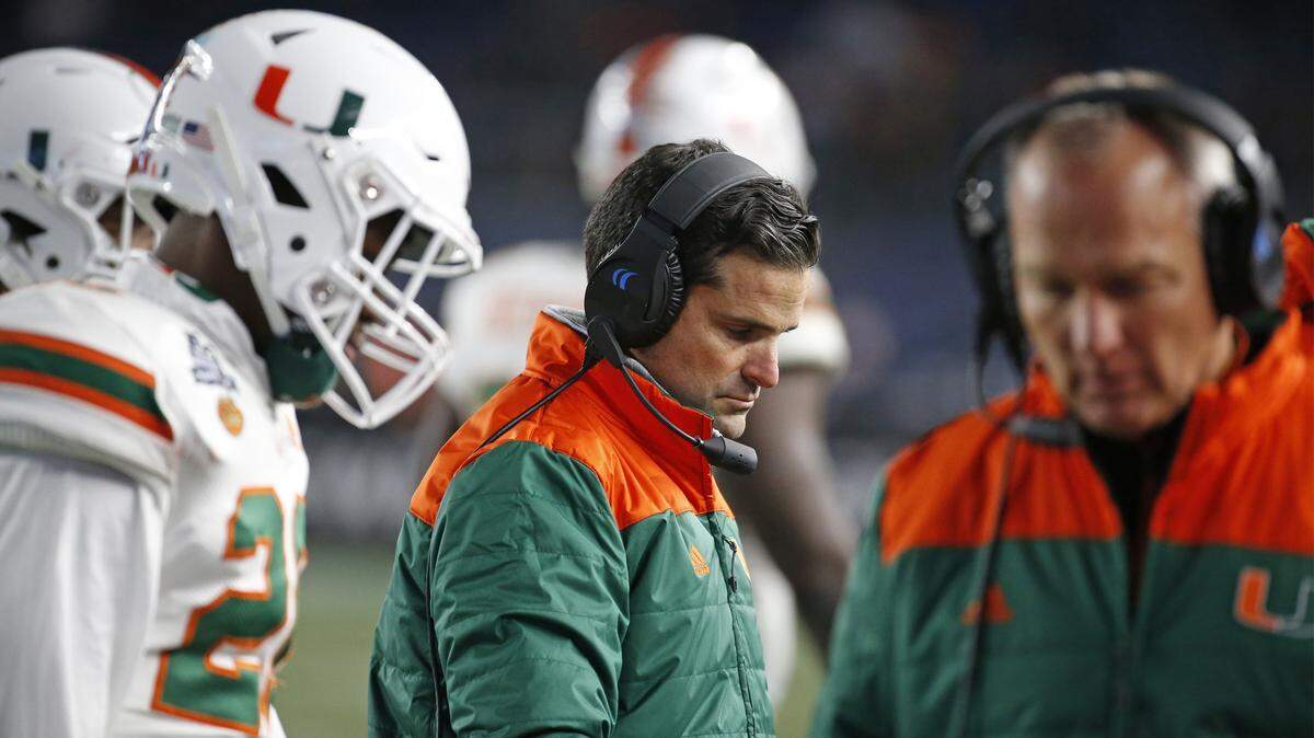 Miami Hurricanes defensive coordinator Manny Diaz and head coach Mark Richt, at right, on the sidelines in the fourth quarter as the Miami Hurricanes play against the Wisconsin Badgers in the 2018 New Era Pinstripe Bowl at Yankee Stadium in Bronx, N.Y. on Thursday, December 27, 2018.