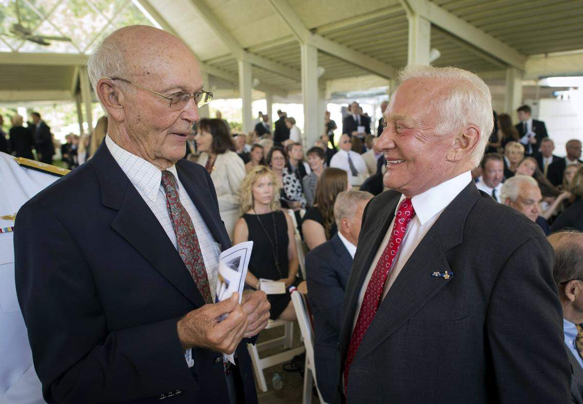 In this handout photo provided by NASA, Apollo 11 Astronauts Michael Collins (L) and Buzz Aldrin (R) talk at a private memorial service celebrating the life of Neil Armstrong, at the Camargo Club on Aug. 31, 2012 in Cincinnati, Ohio. Armstrong, the first man to walk on the moon during the 1969 Apollo 11 mission, died Aug. 25, 2012. He was 82.