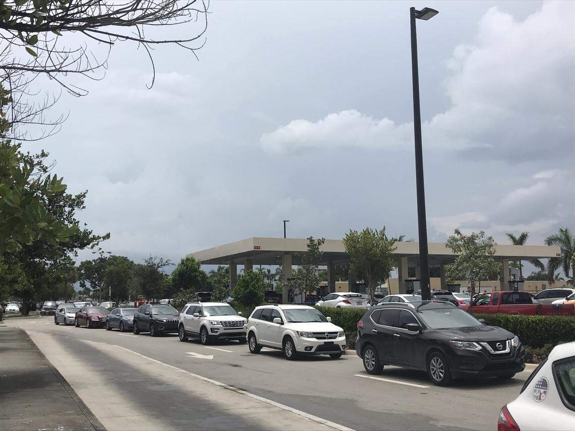 Lines of cars snake around the block to get into a Costco gas station in Miami-Dade at Northwest 79th Avenue on Aug. 29, 2019, ahead of Hurricane Dorian.