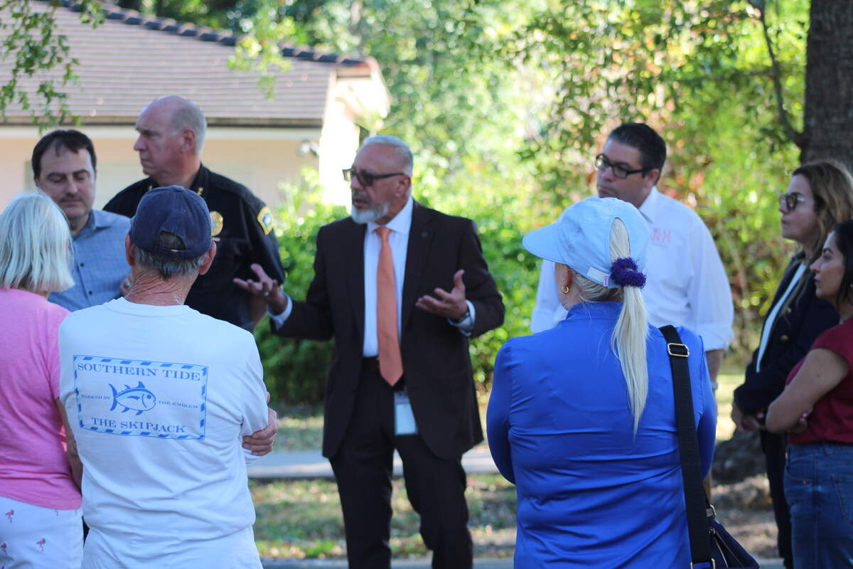Deputy City Manager&nbsp;José Gómez speaks to a crowd of Italian Village residents in Coral Gables to discuss safety measures after Carrot the Cat’s death.