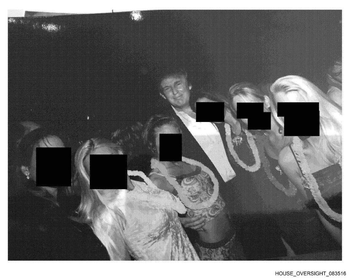 Donald Trump is shown next to six unidentified women, in an undated photo provided by Jeffrey Epstein’s estate to the House Oversight Committee.