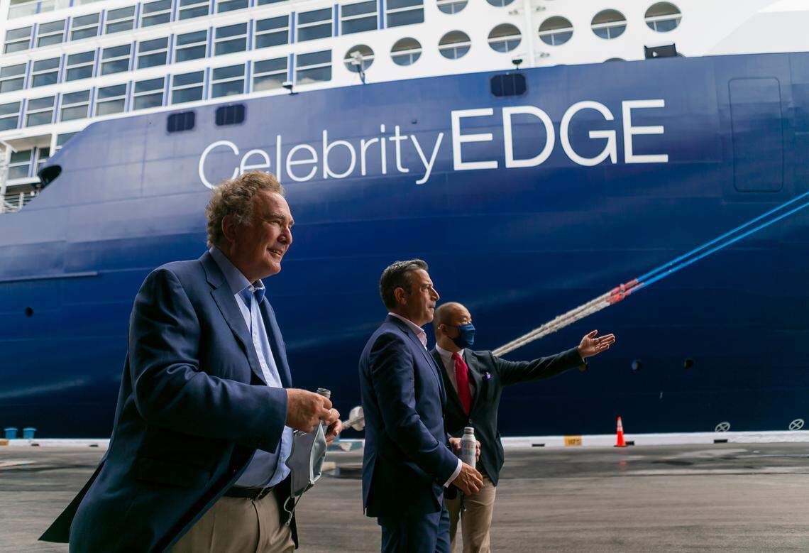 Richard Fain, Chairman and CEO of Royal Caribbean Group, far-left, and Brian Abel, Senior Vice President of Hotel Operations with Celebrity Cruises, center, make their way to the front of Royal Caribbean’s Celebrity Edge cruise ship docked at Port Everglades in Fort Lauderdale, Florida on Saturday, June 26, 2021. After departing Port Everglades Saturday, Royal Caribbean’s Celebrity Edge will be the first cruise ship sailing with guests from a U.S. port in over 15 months.
