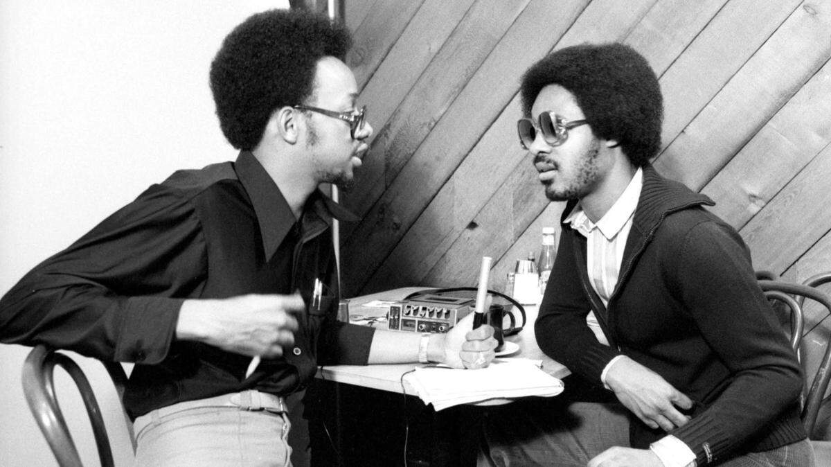 At 19, Leonard Pitts, left, interviewed singer Stevie Wonder for Soul Magazine at Roscoe’s House of Chicken and Waffles in Hollywood, California in 1977. This photo was featured in photographer Bruce W. Talamon’s book, “Soul R&B Funk: Photographs 1972-1982.” Wonder had recently released his landmark “Songs in the Key of Life” album.