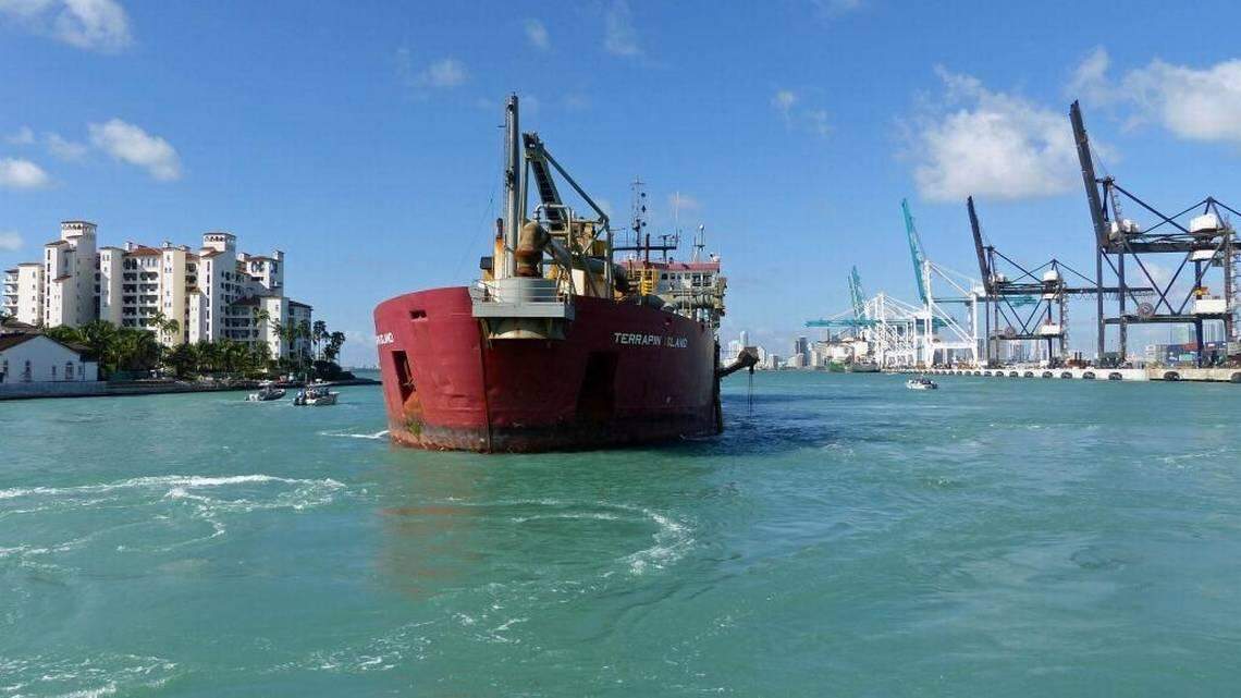 The dredger Terrapin Island sits in the center where it will deepen PortMiami in order to accommodate Super Tankers in the future in this Dec 6, 2013, file photo.