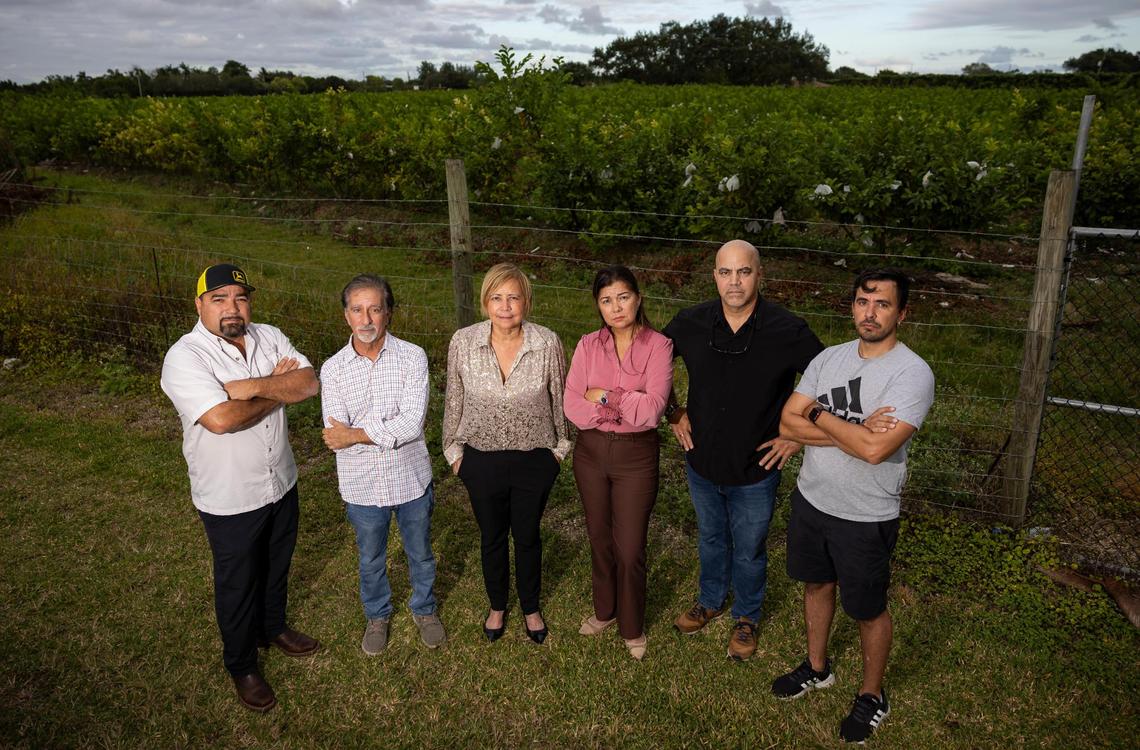 From left to right: Neighbors Esequiel Martinez, Matthew Rendini, Indiana Gonzalez, Margarita Valencia, Karel Alvarez, and Alexei Enriquez stand in front of a farm in the Redlands that’s also the site for a proposed Muslim cemetery. The residents mostly oppose the project due to its proximity to their homes.