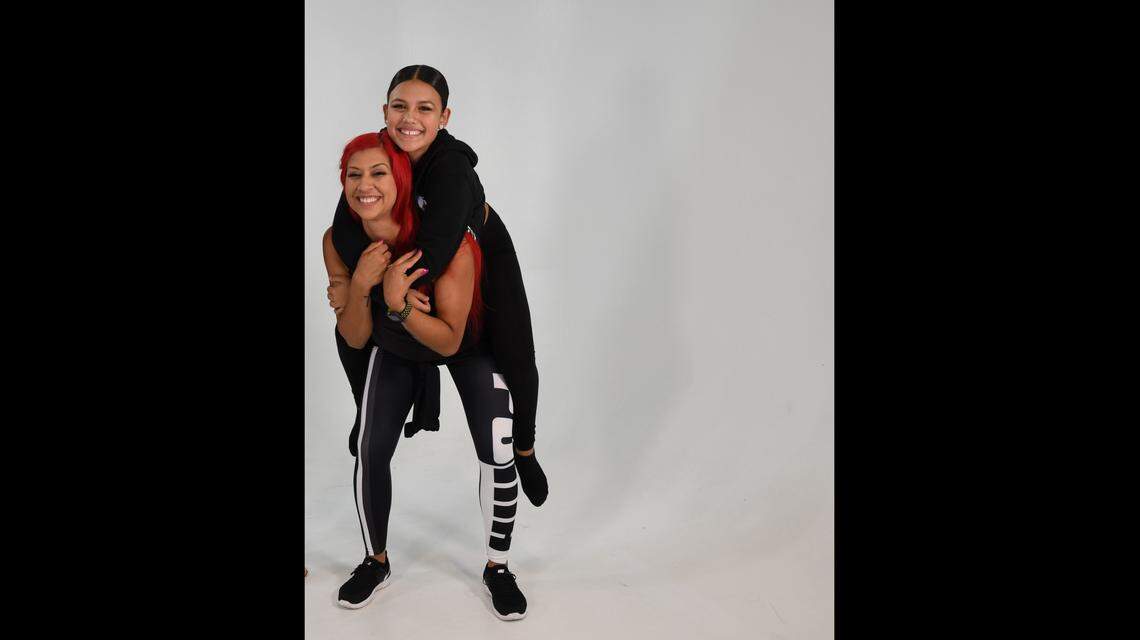 Dance director Mady Richmond and student Ayleen De Anda share a moment. Richmond directs Mady’s Dance Factory in Miami and founded the nonprofit One Heart Foundation to help children overcome obstacles in their lives through dance.
