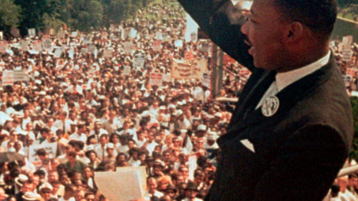 Dr. Martin Luther King Jr. acknowledges the crowd at the Lincoln Memorial for his “I Have a Dream” speech during the March on Washington, D.C. on Aug. 28, 1963.