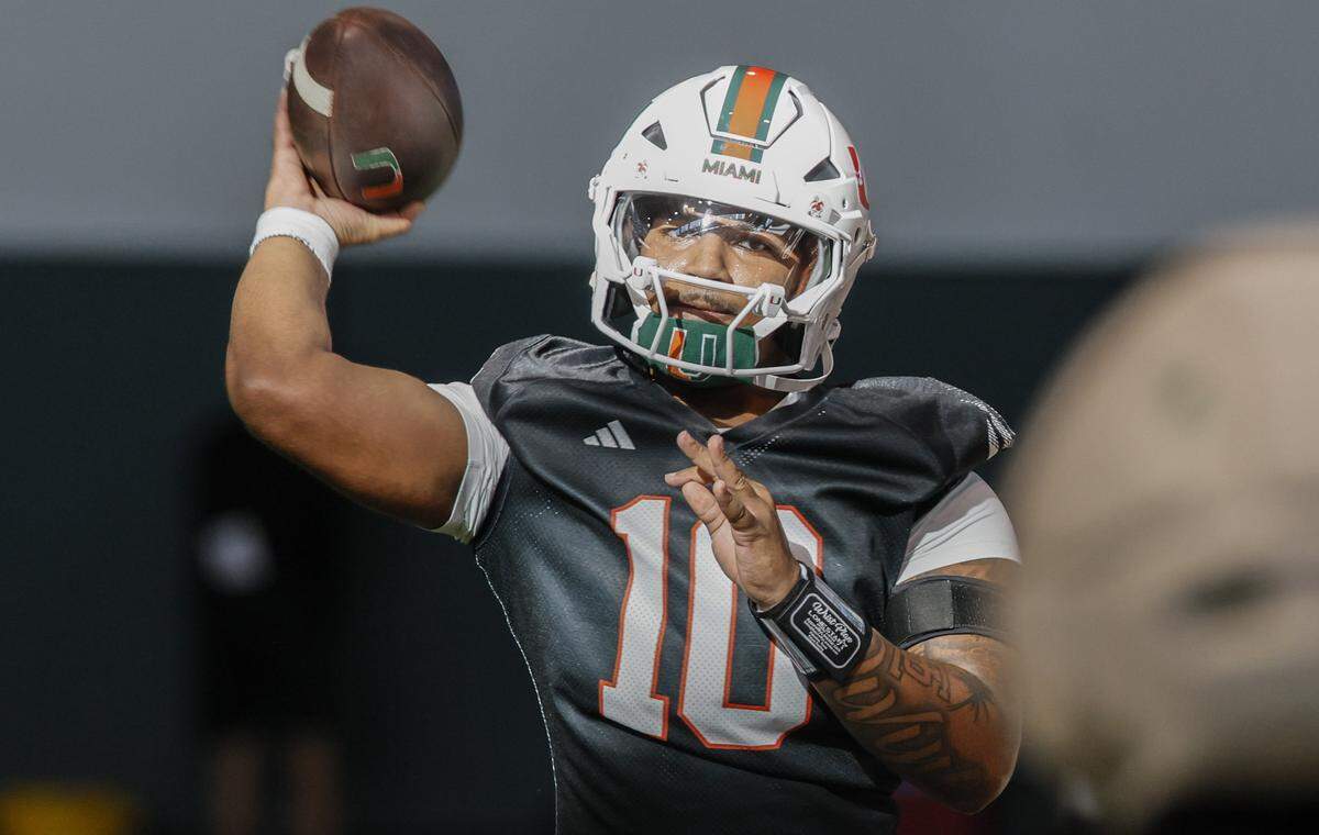 Miami Hurricanes quarterback Darian Mensah (10) throws a pass during drills at the Carol Soffer Indoor Practice Facility on the Uinversity of Miami campus in Coral Gables, Florida, on Tuesday morning, March 24, 2026.