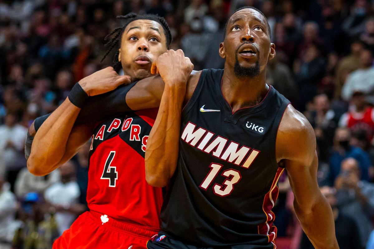 Miami Heat center Bam Adebayo (13) boxes out Toronto Raptors forward Scottie Barnes (4) during the second overtime of an NBA game at FTX Arena in Downtown Miami, Florida, on Saturday, January 29, 2022.