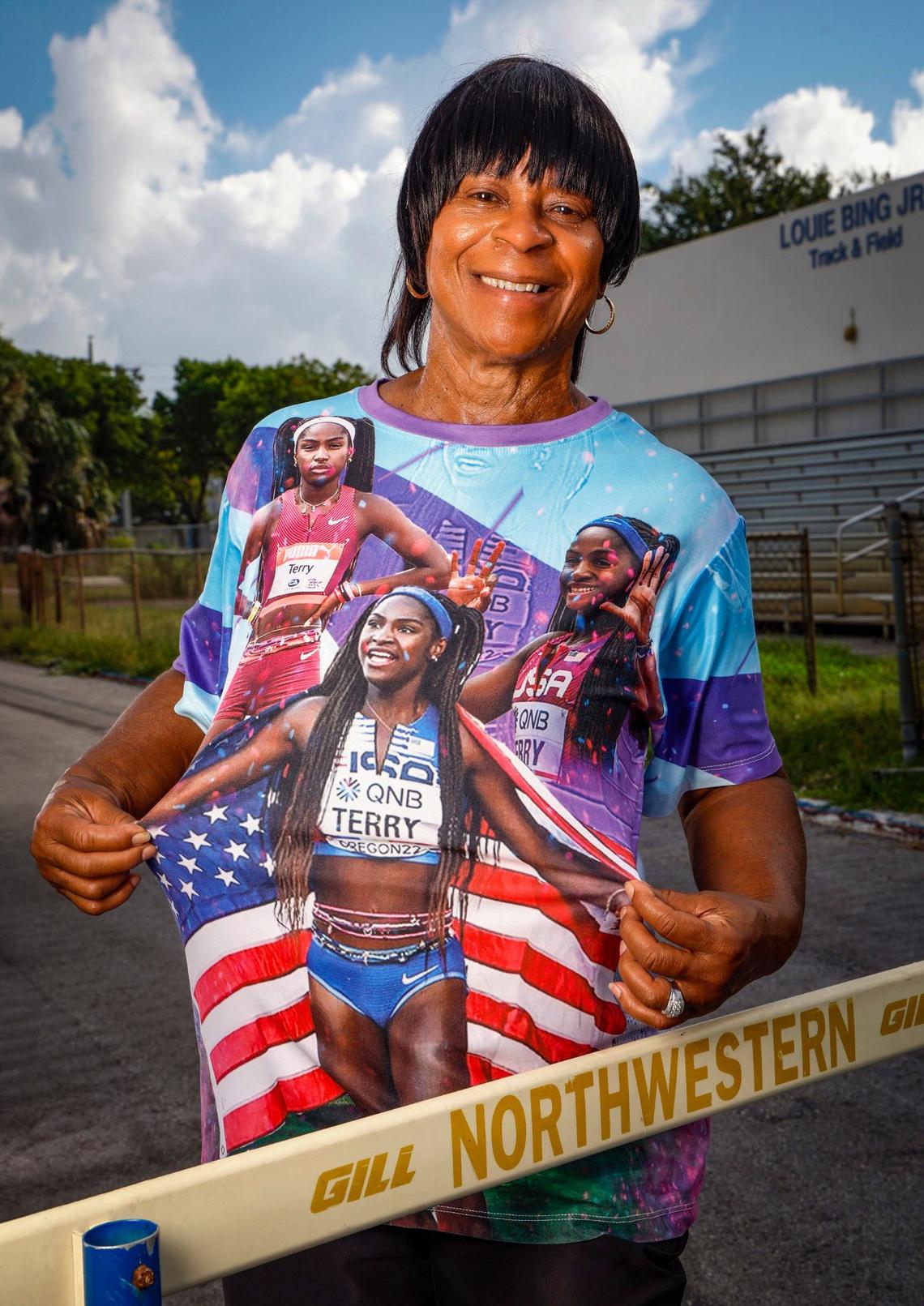 Miami Northwestern High track and field coach Carmen Jackson wearing a T shirt emblazoned with former student Terry on the school’s track in Miami, Florida on Wednesday, July 17, 2024.