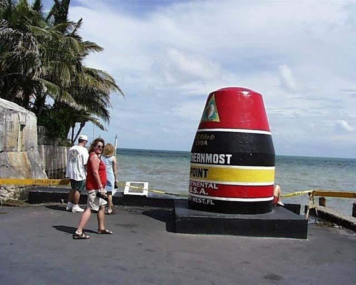 Tourists flock to the Southernmost Point, one of Key West’s best known landmarks.