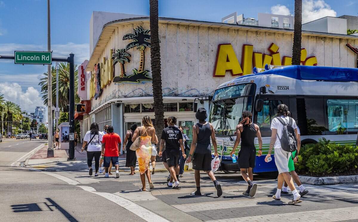 Pedestrians crosses the street intersection at Lincoln Road and Collins Avenue, a hotspot where pedestrians get hit and seriously injured or killed, on Thursday June 11, 2026.