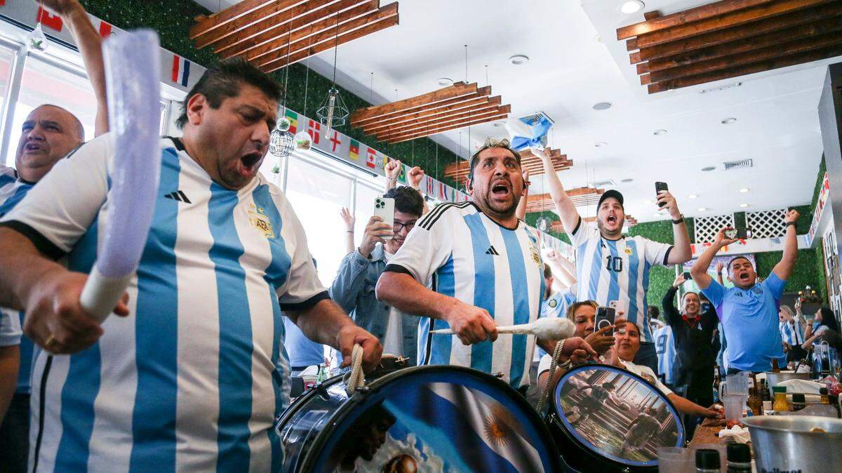 Argentinian soccer fans celebrate after Argentina scored a goal against Croatia during a World Cup watch party at restaurant Manolo in Miami Beach, Florida, Tuesday, December 13, 2022.