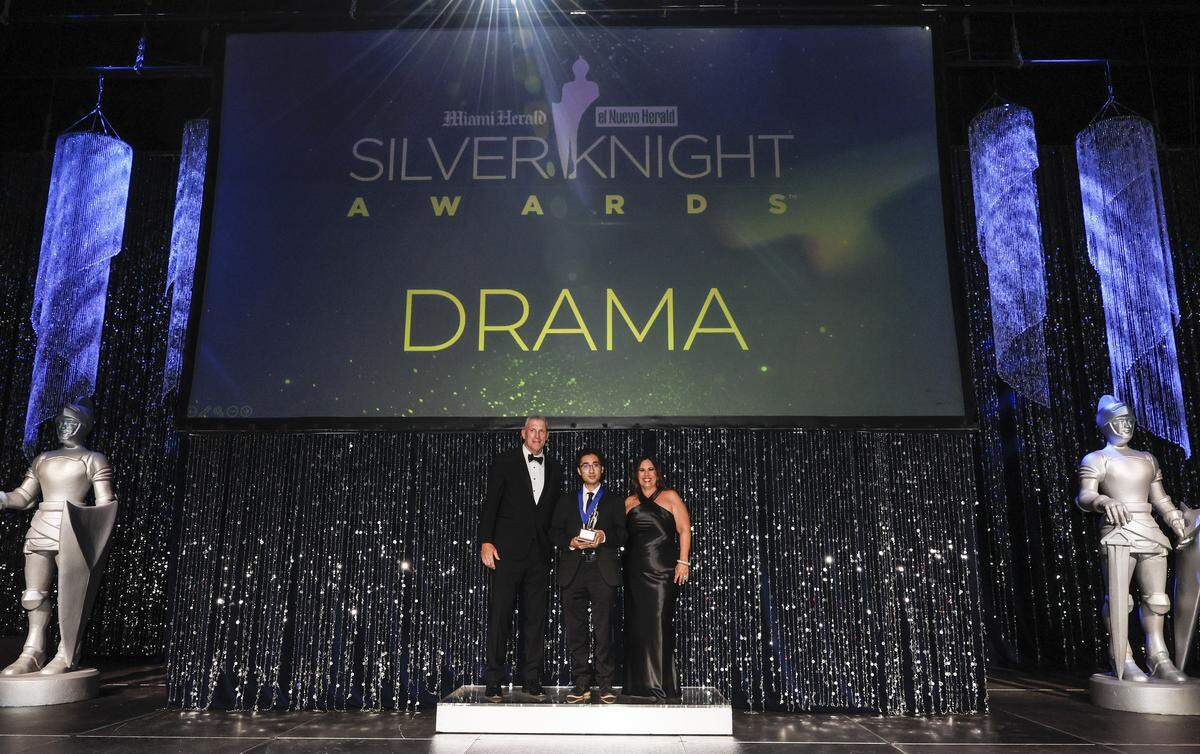 Cardinal Gibbons High School student Lucas Himawan reacts after winning the Silver Knight Award for drama as he stands with Bob McFarlin, Executive Vice President of Technology & Security for McClatchy Media and President of Herald Charities along with Denise Martinez, Vice President of Advertising for the&nbsp;Miami Herald and el Nuevo Herald during the 68th Silver Knight Award Ceremony at the James L.&nbsp;Knight&nbsp;Center on Tuesday, May 12, 2026, in downtown Miami, Fla. 