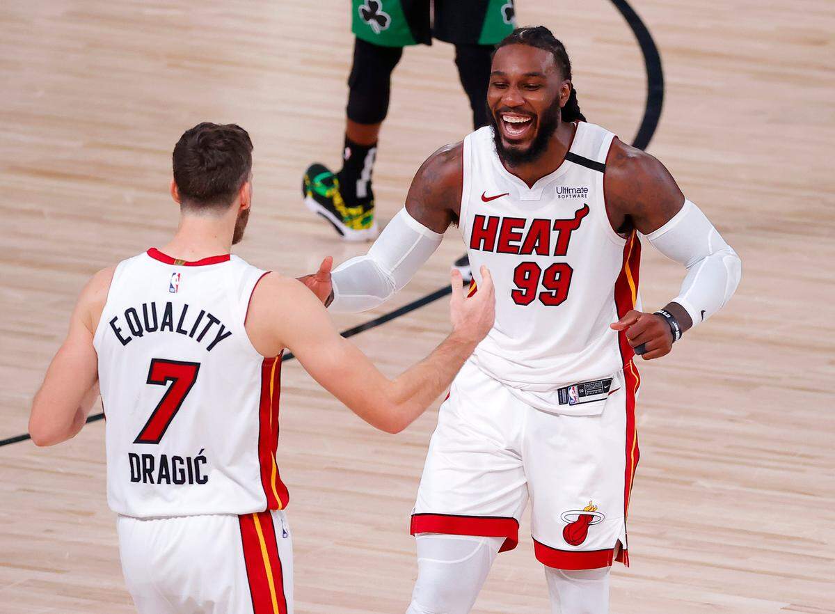 Jae Crowder #99 of the Miami Heat and Goran Dragic #7 of the Miami Heat react after their win over Boston Celtics in Game 2 of the Eastern Conference finals during the 2020 NBA Playoffs at AdventHealth Arena at the ESPN Wide World Of Sports Complex on Sept. 17, 2020 in Lake Buena Vista.