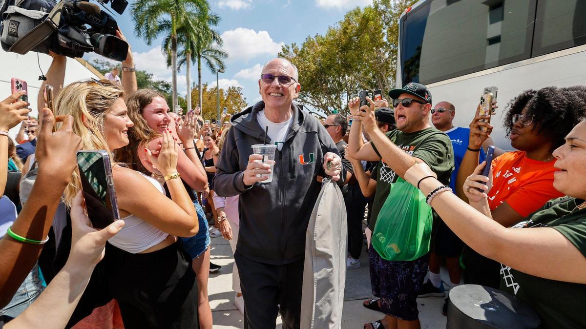 Happier Times: Miami Hurricanes men’s basketball head coach Jim Larrañaga is greeted by fans outside the University of Miami’s Watsco Center as the team prepares to depart on Wednesday, March 29, 2023, for the NCAA Final Four games in Houston. The Hurricanes are 4-7 so far this season.