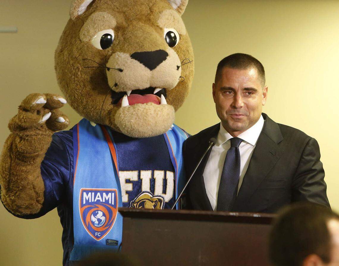 Riccardo Silva, owner of the Miami Football Club poses with the FIU mascot Roary before the start of the press conference at the Stadium Club at FIU stadium.