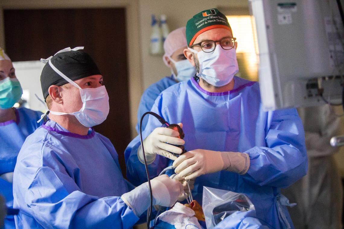 Dr. Ricardo Komatar, left, and Dr. Zoukaa Sargi, right, remove a pituitary tumor via a technique called endoscopic endonasal approach, at Sylvester Comprehensive Cancer Center.