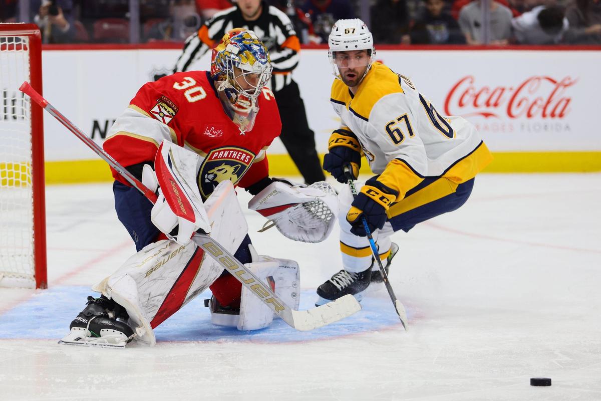 Florida Panthers goaltender Spencer Knight (30) defends his net against Nashville Predators left wing Alexander Campbell (67) during the second period of an NHL preseason game at Amerant Bank Arena in Sunrise, Florida, on Sunday, September 22, 2024.