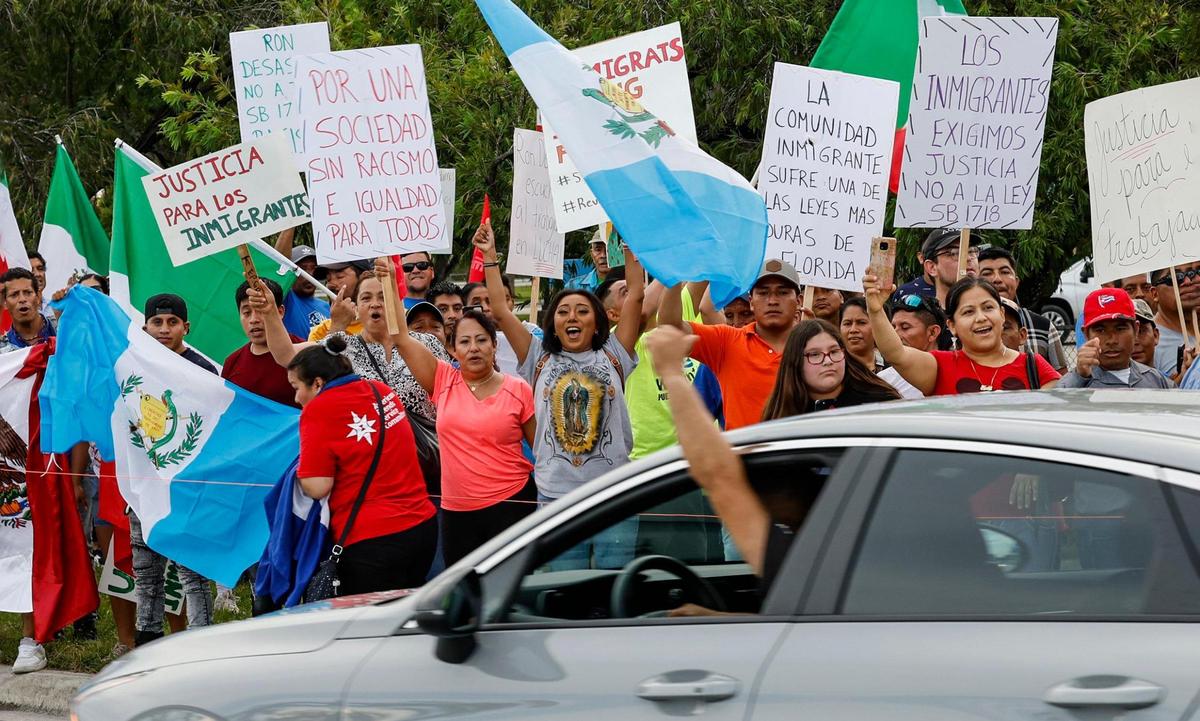 A passerby gives the thumbs up as protestors march along US1 in Homestead, Florida during a “Freedom For All” rally against the bills passed by the Florida Legislature and signed into law by Gov. Ron DeSantis on Saturday, July 1, 2023.