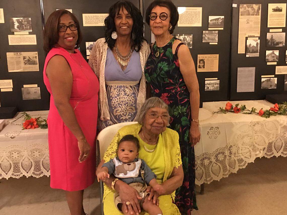 At the June 2017 Stirrup family reunion: Standing from left are Barbara Stirrup, wife of E.W. Franklin Stirrup III; Carol Davis Byrd; and Iral Davis Porter. Seated is Dr. Dazelle Dean Simpson with Tacari Adé Stirrup Wiggins, the then-6-month-old great-great-grandson of E.W. Franklin Stirrup Sr.