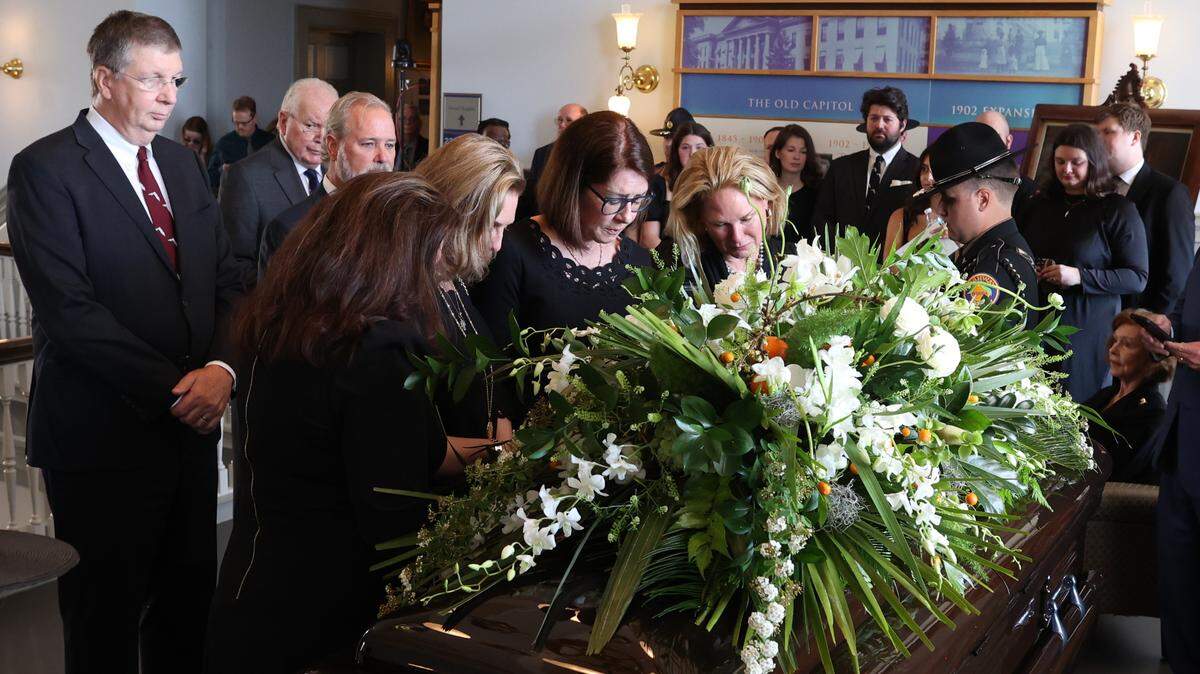 Adele Graham, widow of former Florida U.S. senator and governor Bob Graham, looks over his casket as he lies in state at the Historic Capitol on Friday, April 26, 2024.