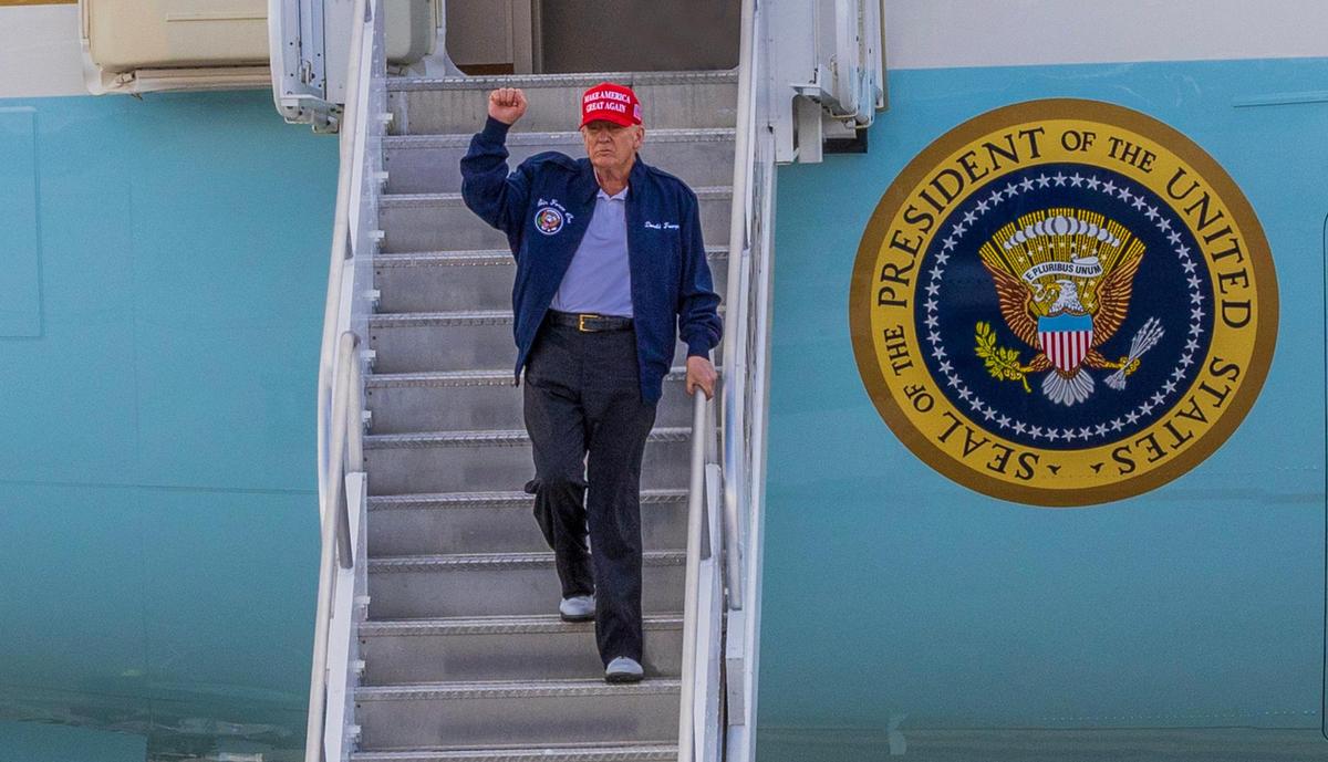 President Donald J. Trump reacts as he arrives on Air Force One at Miami International Airport on Wednesday, Feb. 19, 2025.
