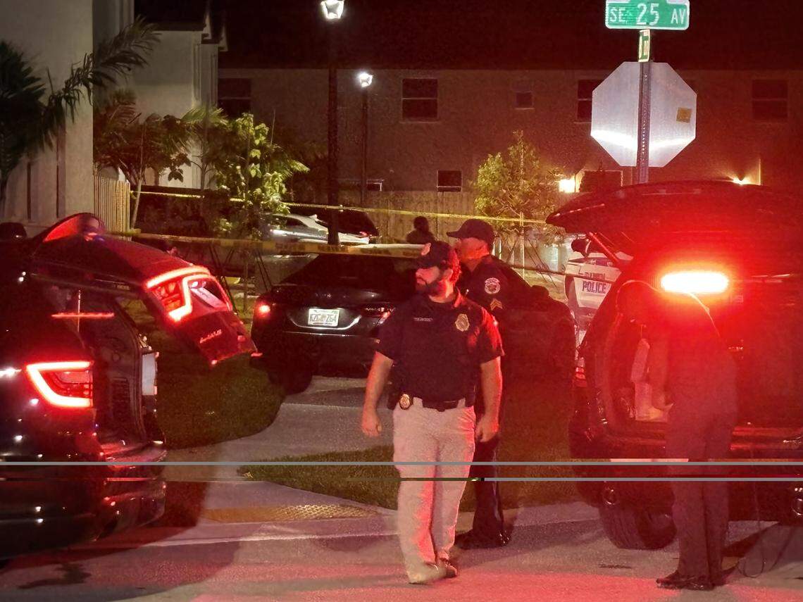 A Florida Department of Law Enforcement agent walks in a neighborhood where a Miami-Dade Sheriff’s Office deputy shot a man Monday, Nov. 3, 2025.
