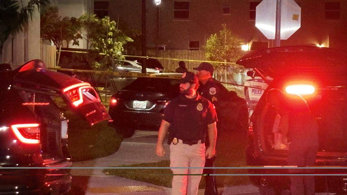 A Florida Department of Law Enforcement agent walks in a neighborhood where a Miami-Dade Sheriff’s Office deputy shot a man Monday, Nov. 3, 2025.