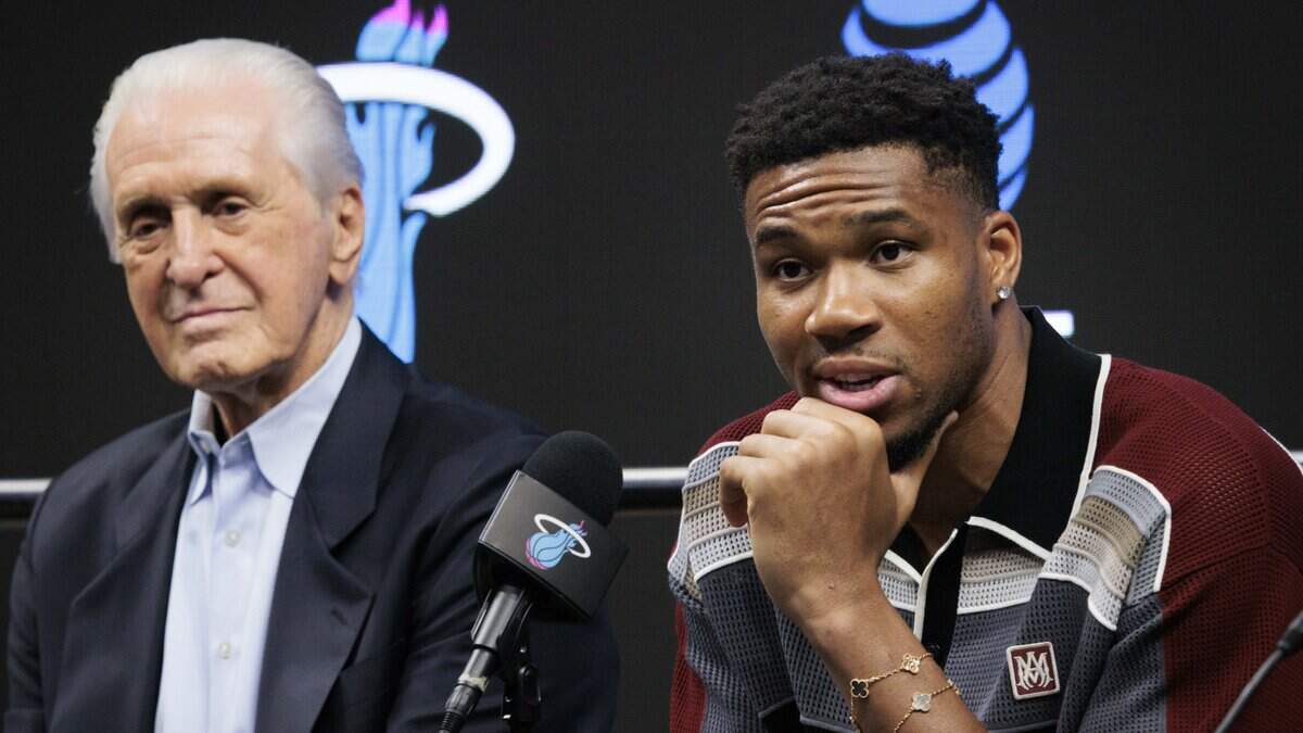 Giannis Antetokounmpo (7), right, speaks speaks during a press conference with Pat Riley, President of the Miami Heat, left, and Head Coach Erik Spoelstra, not pictured, introducing Antetokounmpo to the Miami Heat on Thursday, July 16, 2026, at the Kaseya Center in downtown Miami, Fla.
