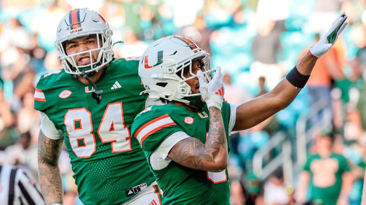 Miami Hurricanes wide receiver Jacolby George (3) and tight end Cam McCormick (84) celebrate George’s score against the Wake Forest Demon Deacons on his way to score in the second half of their NCAA game in Miami Gardens, Florida, on Saturday, November 23, 2024.