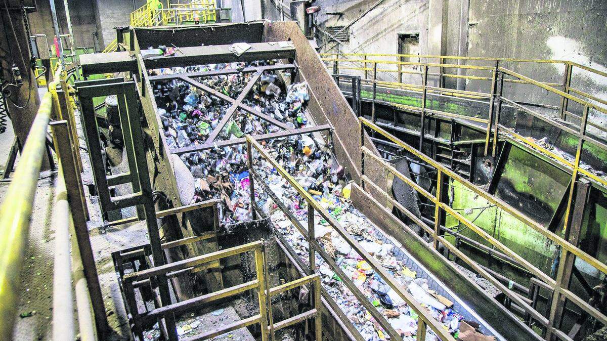 View of recycled materials traveling along a conveyor to be sorted at the Waste Management Recycling Plant in Pembroke Pines. A new contract means millions of dollars more for Miami-Dade County’s access to the plant, driving a proposed increase in trash fees paid by residents.